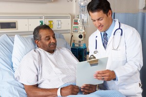 Informed Consent Translation - Doctor Showing Patient His Clipboard