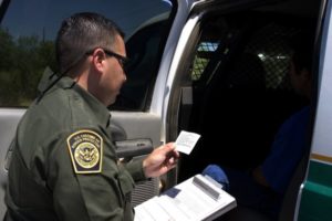 Spanish Miranda Rights - Police Officer Reading Miranda Warning Card