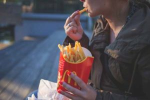 Food Insecurity in the US - Person Eating French Fries